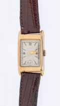 A gentleman's 9ct gold vintage wristwatch, comprising a rectangular silvered dial with applied