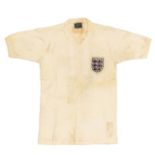 England: A Bukta England, match worn white, v-neck home shirt. Worn by Sir Bobby Charlton in an