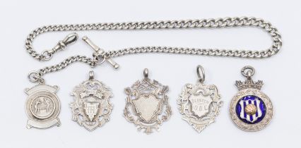 Sporting: A collection of five sporting silver hallmarked medallion fobs, one of which is on a