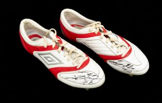 Football: A pair of Umbro football boots, red and white, signed and possibly worn by John Terry. The