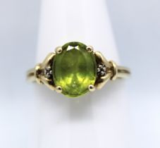 9ct Yellow Gold Oval Brilliant Cut Peridot and Diamond Ring.  The Oval Brilliant Cut Peridot