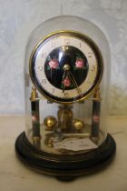 A Roma of Germany 400 day clock under glass dome, together with thermometer. Clock with 3" dial