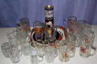 Collection of public house glasses and trays.