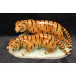 A mid/late 20th century pottery group of two tigers, printed Germany and no 2050, 20cm high x 43cm