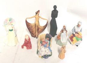 A collection of Royal Doulton and Wade figures , to include Pavlova by Wade C1930's and a smaller