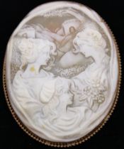 Large Victorian Shell Cameo brooch depicting three ladies with sharp detail. Two of the ladies are