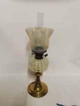 A brass based Victorian yellow vaseline glass oil lamp and shade, 64cm high. (1)