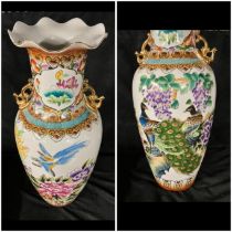 A pair of large 20th C Chinese style vases, decorated with peacock with gilt handles Stand an