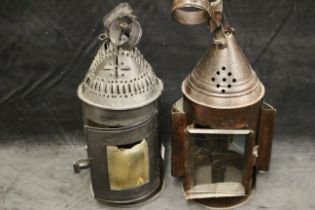 An early 19th century tin plate lantern with pierced domed top, horn panels, suspension loop, 33cm