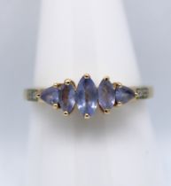 9ct Yellow Gold Tanzanite and Diamond Ring. There is three Marquise shaped Tanzanite and there is