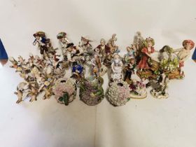 A quantity of 19th century and later continental Meissen style porcelain figures, some damage and