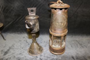 An Eccles protector lamp and lighting co miners lamp, early 20th century and a 19th century tinplate