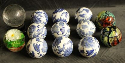 Set of Nine Chinese Blue & White Glazed decorative porcelain balls enamelled in a blue and white