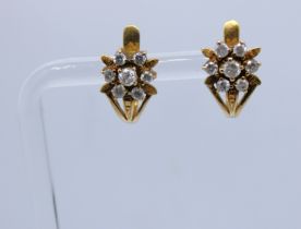 A pair of Unmarked Yellow Metal Diamond Cluster Earrings Total Diamond Carat is approx. 0.90ct.