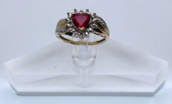 9ct Yellow Gold Pink Heart Shaped Synthetic Ruby & Diamond ring.  The ring is hallmarked '375' for