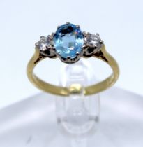 18ct Gold Aquamarine and Diamond ring.  The measurement of the Oval Brilliant Cut Aquamarine