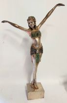 A tall cast metal art deco style figure of a dancer of Palmyra She stands just under 2ft high