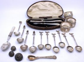 A selection of unmarked white metal spoons and plated ware.  There is six unmarked white metal