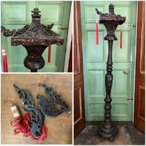 An Oriental hardwood standing lamp, damages to top shade, some pieces missing and previously