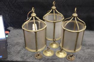 3 x Brass ceiling lights with frosted glass inserts and ceiling hangers.
