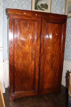 A Victorian flamed mahogany twin wardrobe. 199cm H x 136cm W x 56cm D