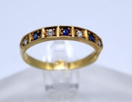 18ct Gold Seven Stone Round Brilliant Cut Diamond and Sapphire Half Eternity ring.  There is four