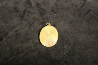 15ct Gold Oval engine turned locket. Engraved inside "Clive from Violet August 25th 1917".