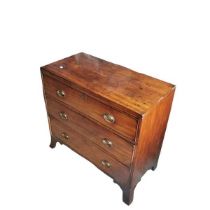 An early 19th century mahogany 3 drawer chest with pressed brass handles raised on bracket feet.