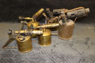 Five early 20th century brass blowtorches to include examples by Primus, Euksson's of Sweden etc