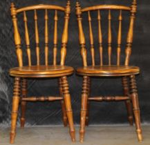 A pair of Swedish "Ibex" chairs with baluster turned splats, circular seats , on turned legs