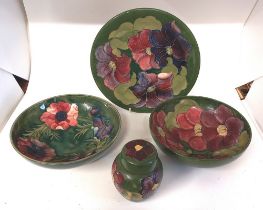 4 x Moorcroft green ground items , various Moorcroft back stamps. Impressed. Decorated in the