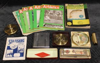 A mixed lot of anglers guides and athletics guides, a Larry Adler Junior Model harmonica, a margaret