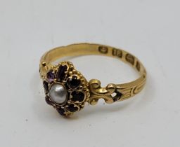 A Victorian 18ct. gold pearl and garnet ring, Birmingham 1861, the octofoil mount with cultured