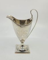 A George III silver neo-classical jug, by John Lambe, London 1787, of helmet form, with beaded rim