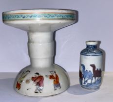 A Chinese famille rose stand and a Chinese pottery snuff bottle