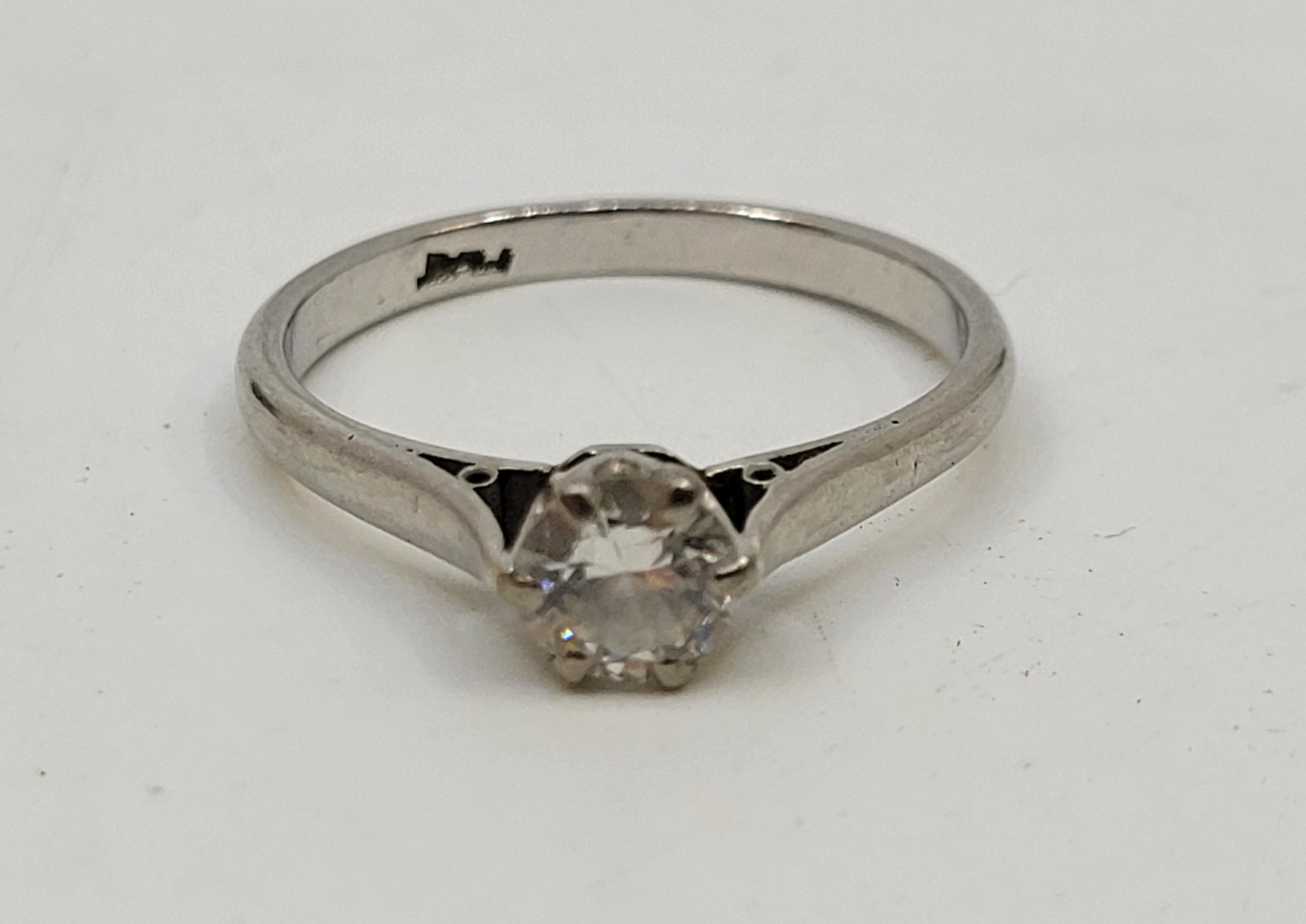 A platinum diamond solitaire ring, claw set round brilliant cut diamond (EDW 0.40 carats), size UK - Image 2 of 3