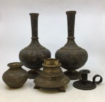 A collection of five Indian bronze items to include a pair of Indian bronze vases, a candle