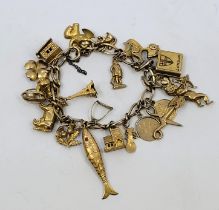 A 9ct. gold charm bracelet, the Figaro chain bracelet suspending 16 x 9ct. gold charms, 2 x 18ct.