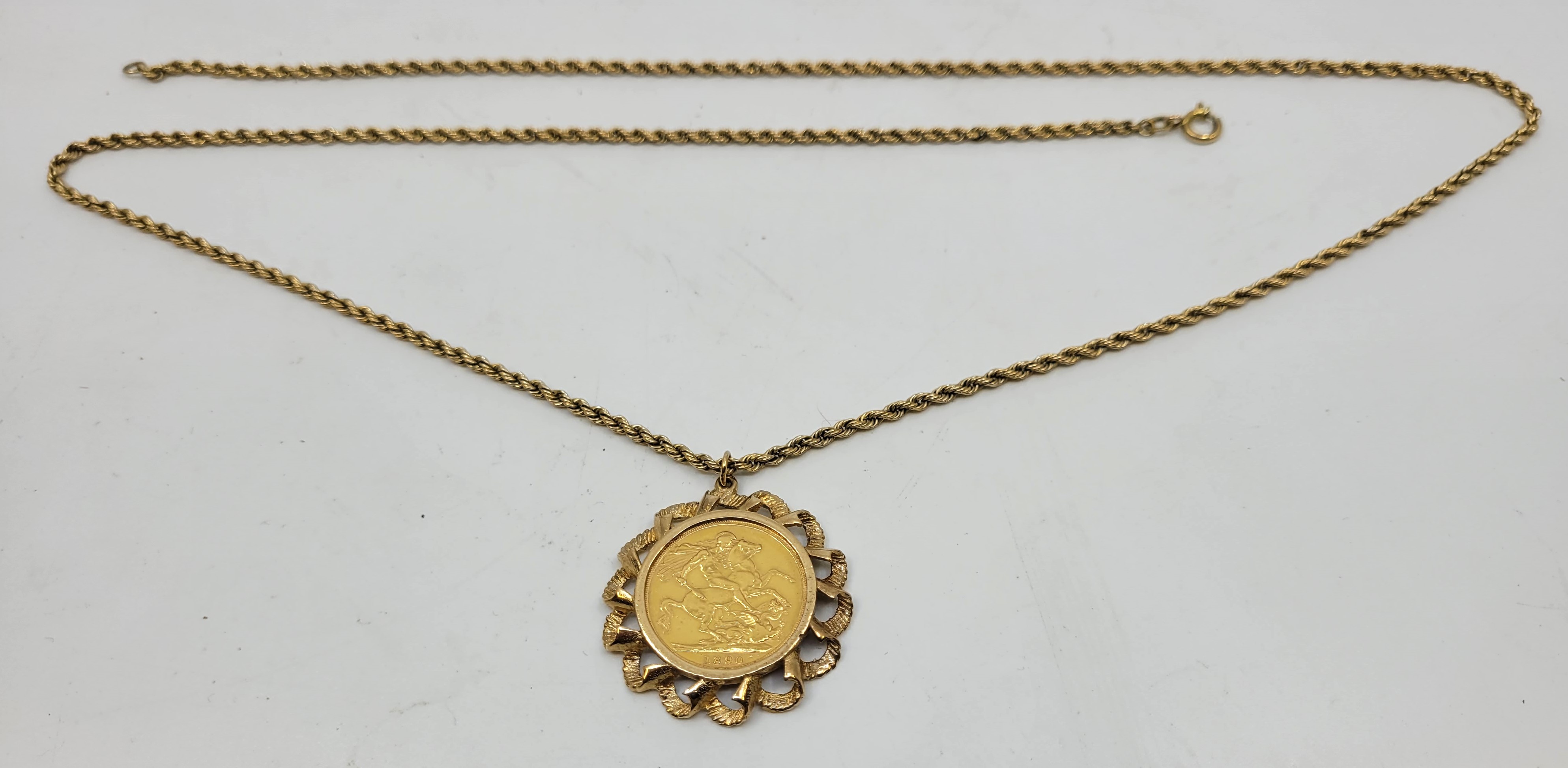 A Victoria 1890 "jubilee bust" gold sovereign coin, London mint, in 9ct. gold pendant mount,