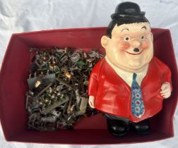 A  vintage Laurel & Hardy figure and a collection of lead soldiers