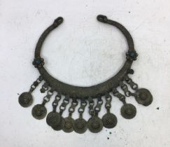 A Tibetan metal choker together with a figures of buddha and four small oriental figures (a/f)