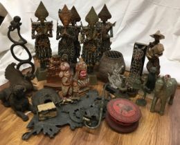 A large collection of wooden/ terracotta figures. (qty)