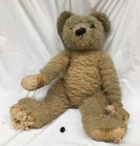 A very large oversized  early 20th straw filled Teddy bear , possibly Chiltern (a/f)