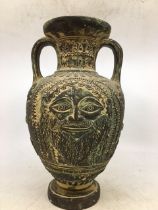 A large Greek bronze vase.