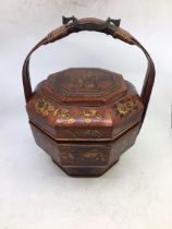 A Chinese hexagonal wooden basket with handle together with three Chinese wooden figures and a