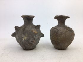 A pair of Indian terracotta vases. H: (a/f)