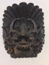 A Sino-Tibetan carved wooden figure of a deity. H:20cm