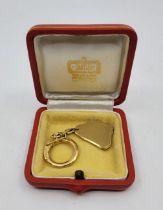 A Cartier 18ct. gold keyring, stamped Swiss hallmark, makers mark for Cartier Ltd and London