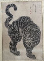 A Japanese woodblock of a tiger, 44cm x 30cm