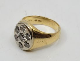 A Gentleman's 14ct. gold and diamond signet ring, the oval white gold mount set seven round